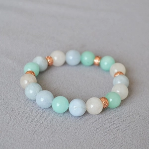 Minimalist summer beaded bracelet with blue-green stones and rose gold spacers