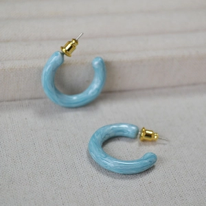 Handmade light blue enamel C-shape hoop earrings with white marble texture and gold pins