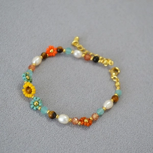 Bohemian woven beaded bracelet with Van Gogh sunflower style pearls and tiger eye stones