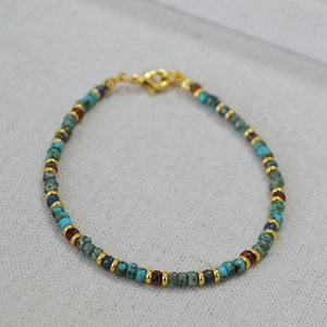 Bohemian Miyuki bead bracelet with turquoise and navy blue accents and golden clasp