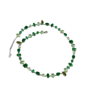 Silver necklace with mixed emerald green gemstones in oval and teardrop shapes
