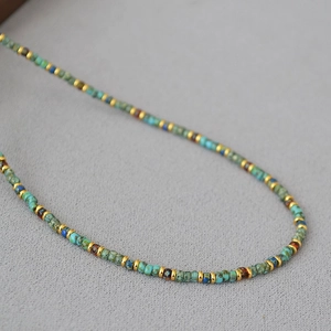 Macro shot of Bohemian beaded necklace with blue and reddish brown Miyuki Picasso beads