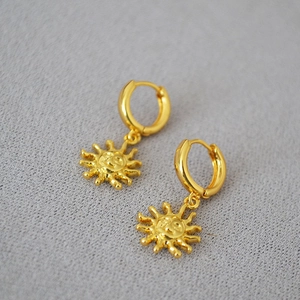 Minimalist gold-plated sun-shaped drop earrings with a smiling face and hoop closure