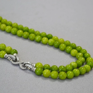 Double-layered olive green beaded necklace with a sparkling silver infinity clasp