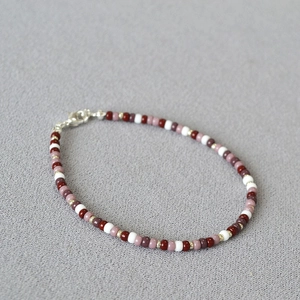 Handmade Miyuki seed bead necklace in red and white with gold accents and silver clasp