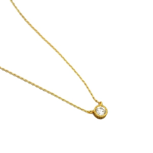 Minimalist gold plated necklace with a single round white cubic zirconia pendant on white