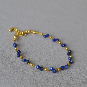 Double-layered lapis lazuli and gold bead bracelet with adjustable lobster clasp closure