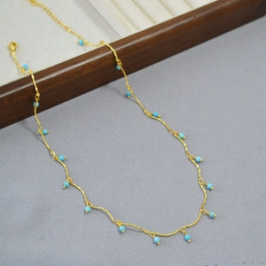 Gold-plated brass necklace featuring turquoise beads and a secure lobster clasp