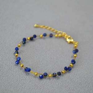 Double-layered lapis lazuli and gold bead bracelet with adjustable lobster clasp