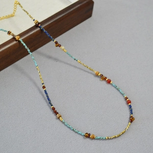 Detail of vintage beaded necklace with turquoise, agate, and gold-plated adjustable chain