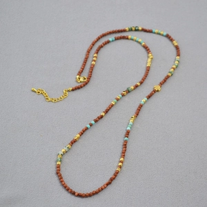 Handmade stone beaded necklace with gold clover pendant and brown goldstone beads