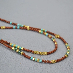 Retro aesthetic beaded necklace with goldstone turquoise and gold metal accents