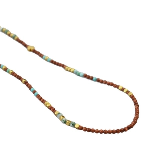Retro beaded necklace featuring brown goldstone and turquoise beads for a vintage aesthetic