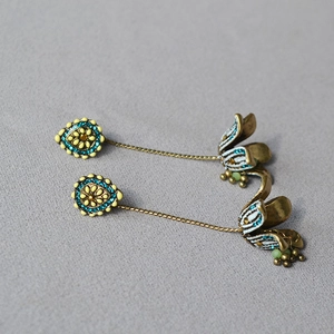 Vintage bohemian flower tassel earrings in bronze with blue crystals and white petals
