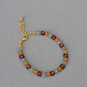 Handmade bohemian beaded flower bracelet with sunset colors and gold lobster clasp