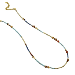 Bohemian beaded necklace with red agate and turquoise stones on a white background