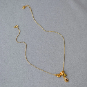 French vintage gold bead necklace with tiger eye stone and multi-shape charms