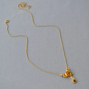 French vintage gold beaded necklace with tiger eye stone pendant and teardrop green gem