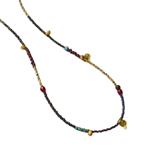 Handmade beaded necklace with yellow teardrop beads and turquoise accents on white backdrop
