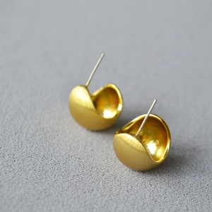 Minimalist brushed gold hollow hemisphere stud earrings with a matte textured finish