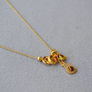 French vintage avocado necklace with tiger eye stone and yellow crystal on gold bead chain