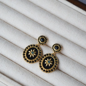 French vintage gold drop earrings with black enamel star and light blue stone inlay