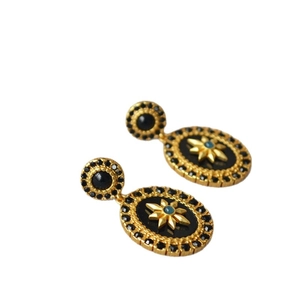 French vintage gold oval earrings with black floral star pattern and blue gemstone center