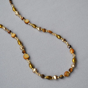 Retro Tiger Eye beaded necklace with earthy brown tones and golden accents for women