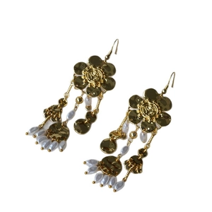 Elegant gold metal flower drop earrings with pearl pendants and hammered texture accents