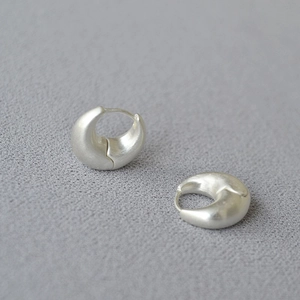 Minimalist matte silver crescent earrings in brushed metal finish with hinged clasp