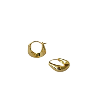 Minimalist irregular U-shaped gold twisted hoop earrings with a polished metal finish