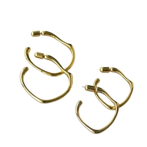 Minimalist irregular geometric golden hoop earrings with polished finish for women