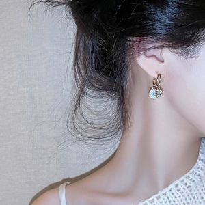 Elegant 925 silver earrings with white mother-of-pearl evil eye and gold sun pendant