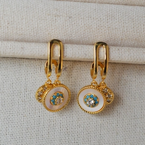 Vintage gold drop earrings with white shell inlay, turquoise beads, and sparkling zircon