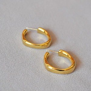 Minimalist irregular lava style gold-plated hoop earrings with polished organic texture