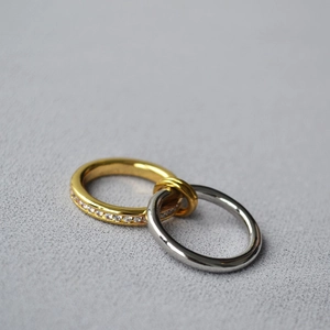 Minimalist layered interlocking ring with sparkling crystals in gold and silver finish