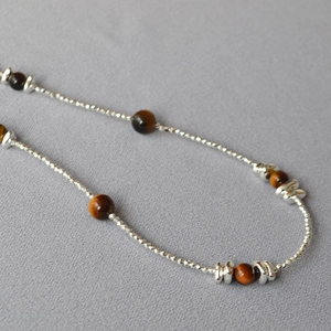 Double-layered tiger eye stone necklace with silver beaded strands and vintage finish
