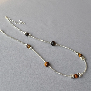 Double-layer tiger eye stone beaded necklace with silver accents and adjustable chain
