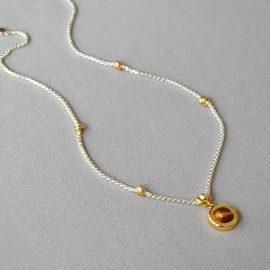 Double-layered tiger eye stone beaded necklace with silver and gold beads in retro style