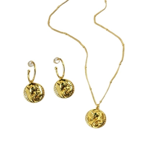 Parure de bijoux dorés avec pendentif licorne et boucles d'oreilles aux yeux de zircon vert