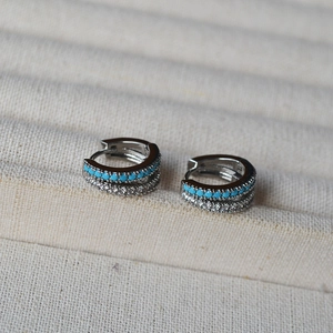 Double-row silver hoop earrings with turquoise beads and sparkling cubic zirconia stones
