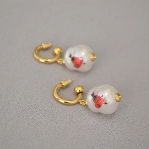Baroque pearl drop earrings in brass gold finish with a red heart pattern detail