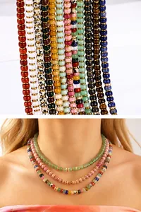 Detail of 18K gold-plated zodiac necklace with multi-color natural stone beads layered