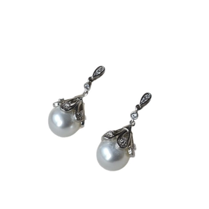 Elegant silver flower stud earrings with shimmering zircon and white pearls for women