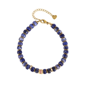 Detail of blue natural stone beads and gold charms with crystals on a stainless steel bracelet