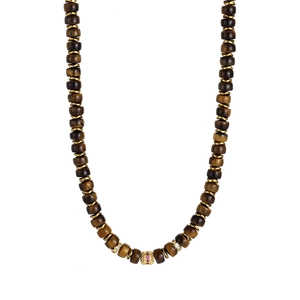 Macro detail of Tiger Eye beaded necklace with 18K gold spacers and crystal charms