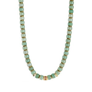 Detail of 18K gold plated necklace with green stones and ruby red crystal pendant