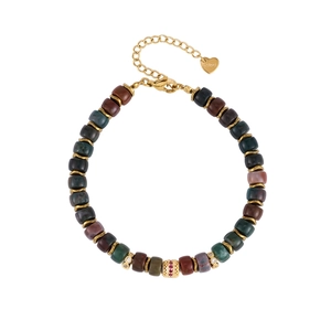 Detailed view of colorful natural stone beads with gold spacer charms and S.steel heart tag