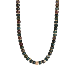 Detailed macro view of vintage natural stone necklace with gold-plated bead accents