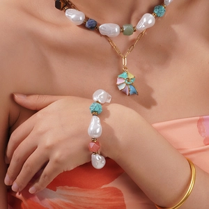 Baroque pearl jewelry set with colorful natural stones and shell pendant on a model